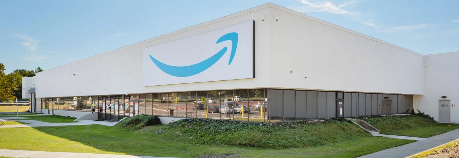 A building with an amazon sign in front of it.