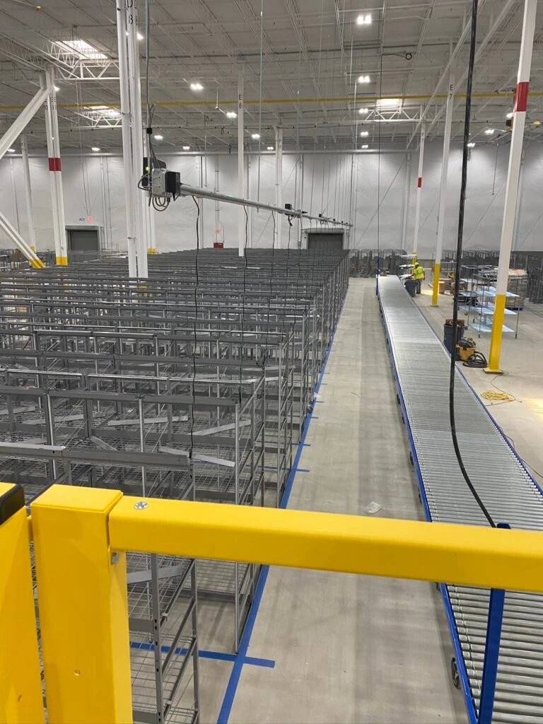 A warehouse with a lot of shelves and racks.