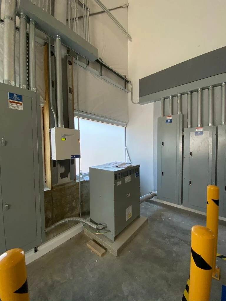 A room with a lot of electrical equipment in it.