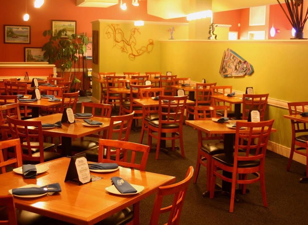 A restaurant with tables and chairs.