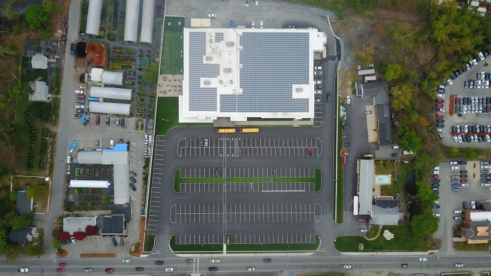 An aerial view of a school building with solar panels.