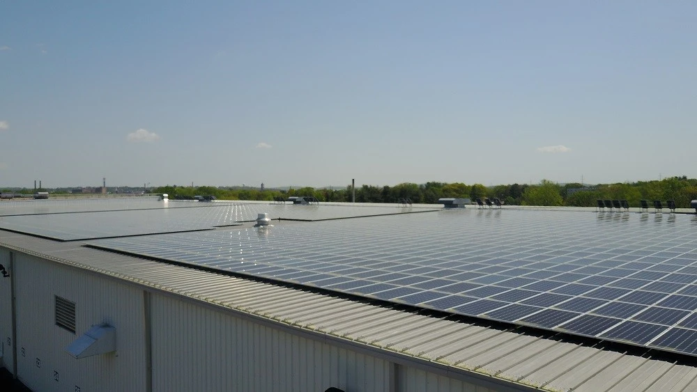 Solar panels on the roof of an industrial building.