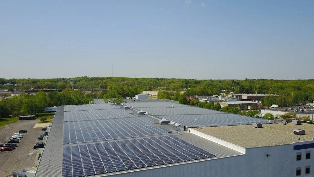 An aerial view of a roof with solar panels.