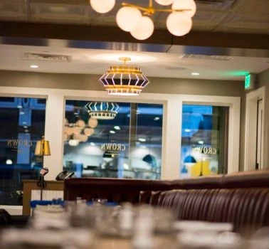 A view of a restaurant with tables and chairs.