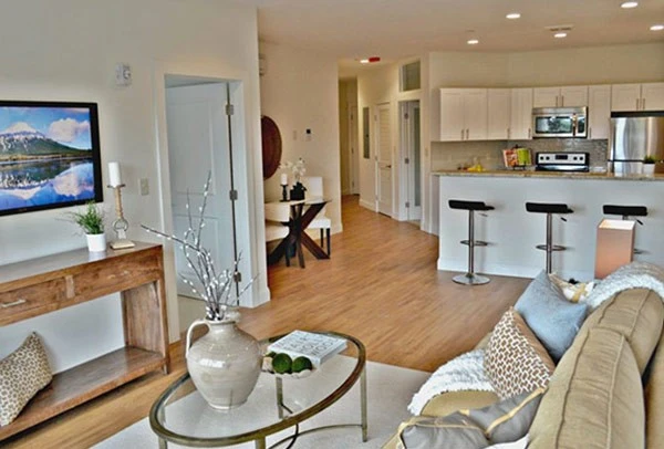 A living room with a tv and a coffee table.
