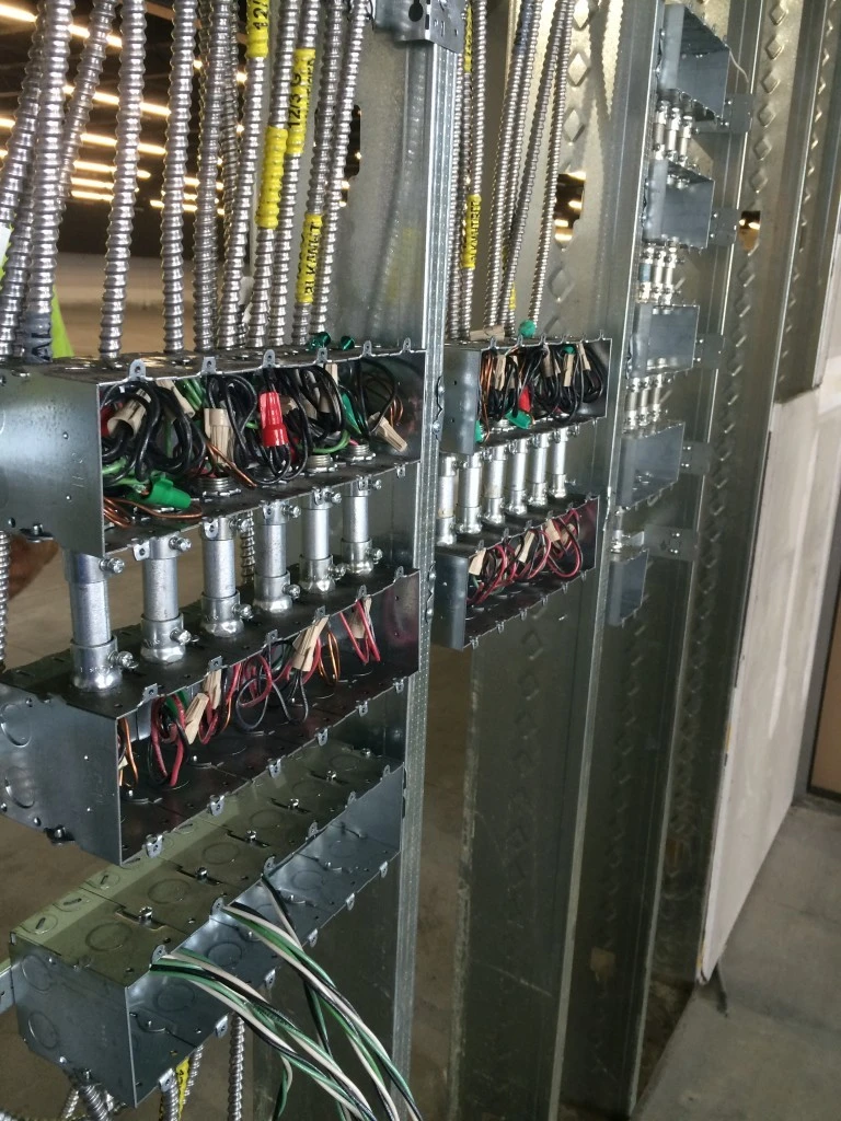A metal panel with wires and wires on it.