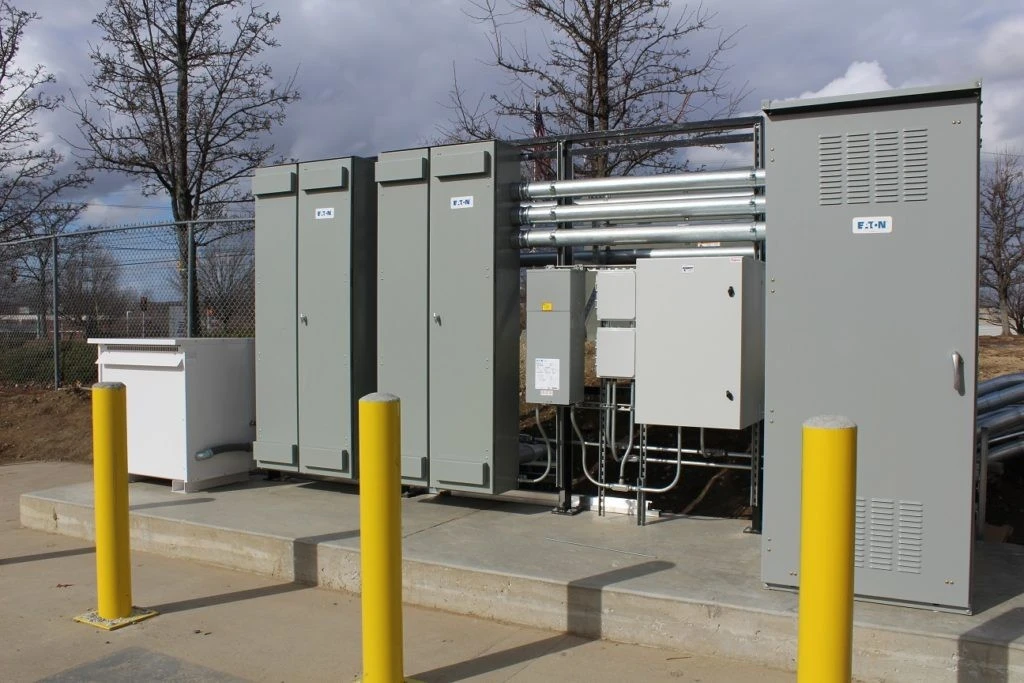 A group of electrical equipment in a parking lot.
