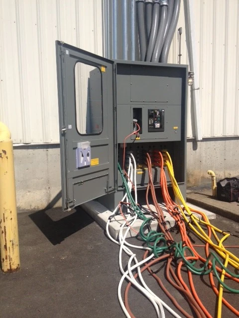 A large electrical box with many wires attached to it.