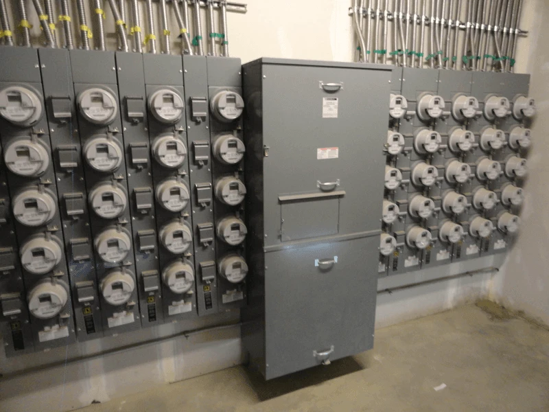 An electrical panel in a room with a lot of wires.