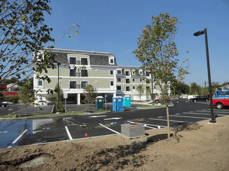 A parking lot in front of a building.
