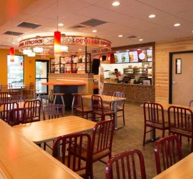 A restaurant with tables and chairs.