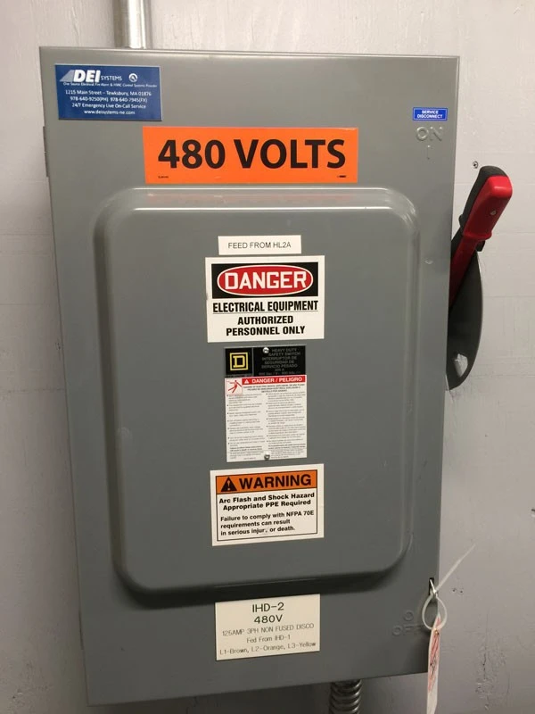 A 480 volt circuit breaker on a wall.