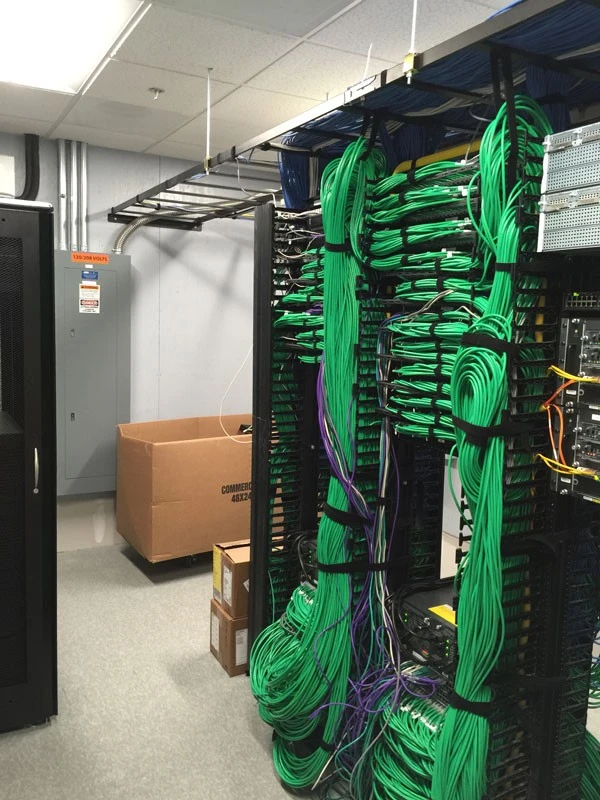 A room full of green wires in a room.