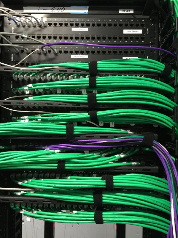 A rack of wires in a server room.