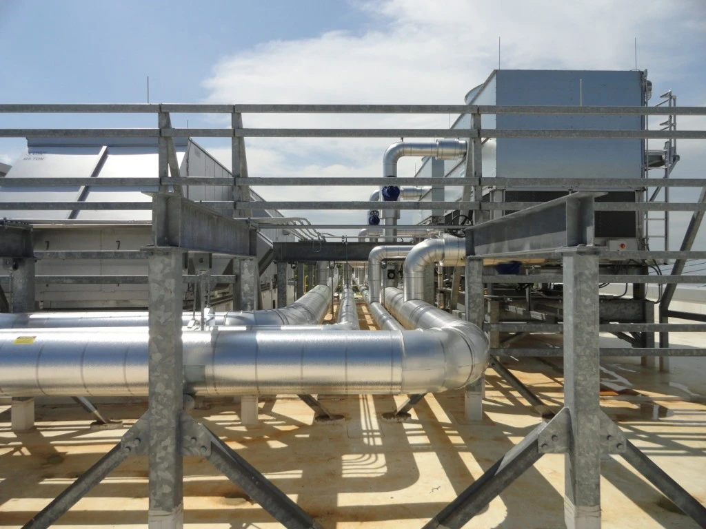 A large metal structure with pipes and pipes on it.