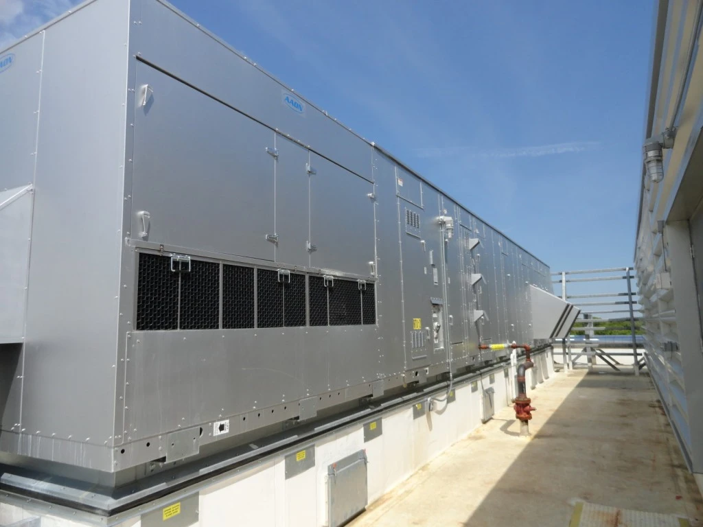 A large air conditioning unit on the side of a building.
