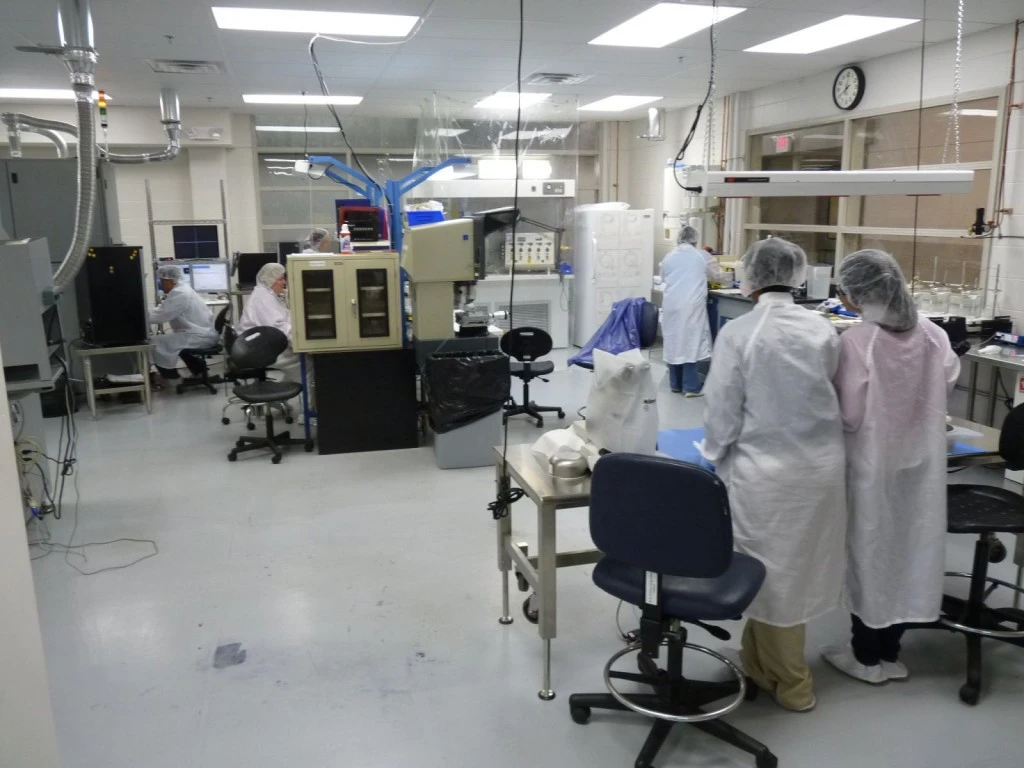 A group of people working in a lab.