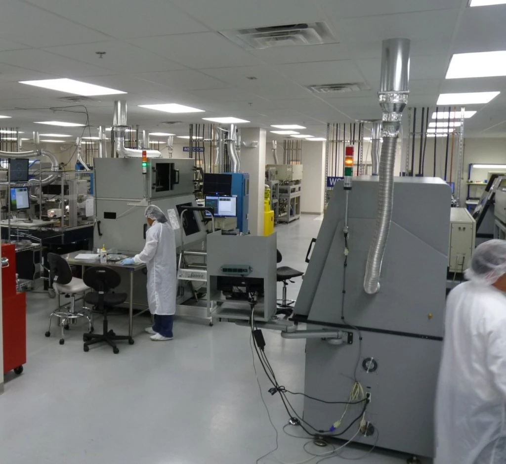 A group of people working in a factory.