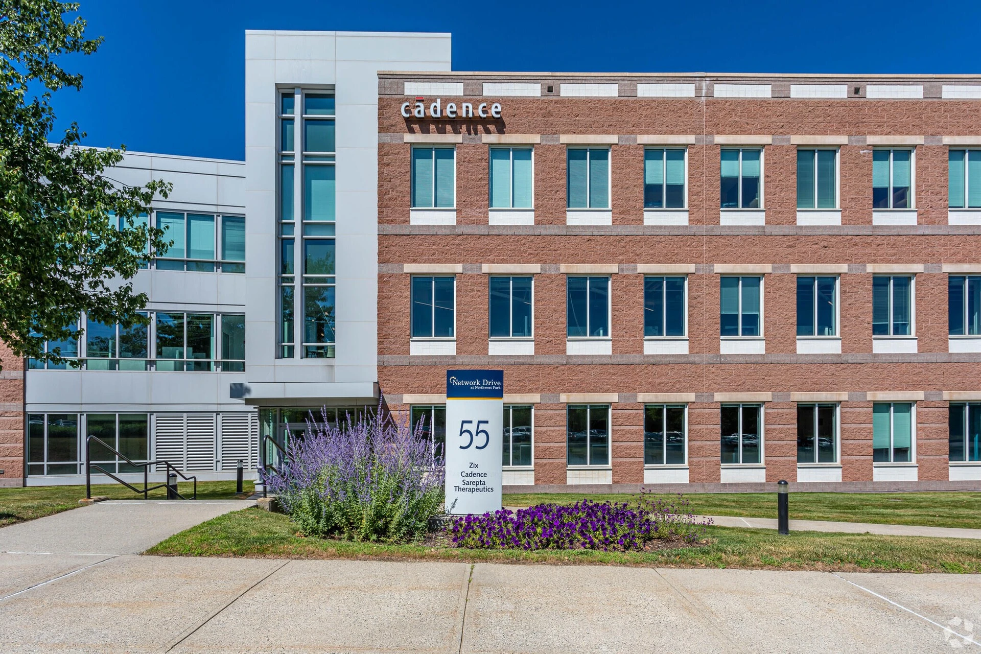 The front of a building with a sign on it.