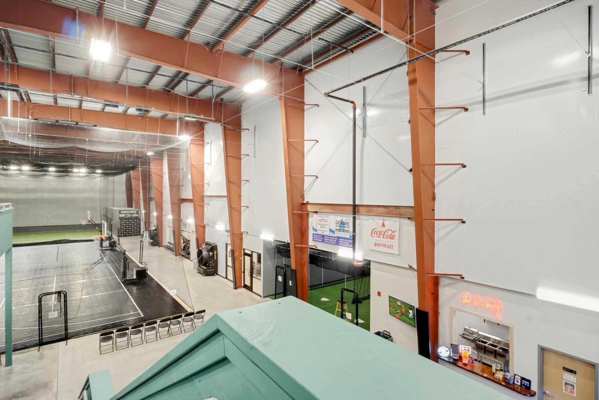 The inside of an indoor tennis court.