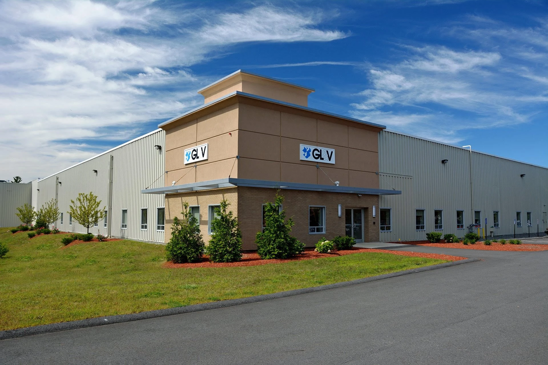 A tan building with a blue sky.