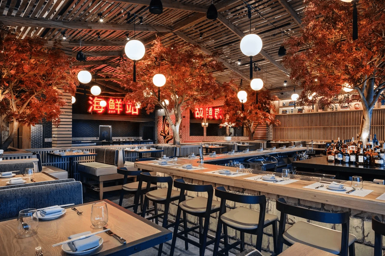 The interior of a restaurant with tables and chairs.