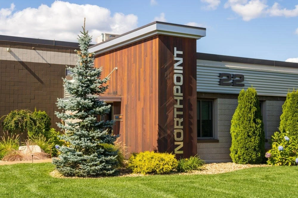 A building with a sign in front of it.