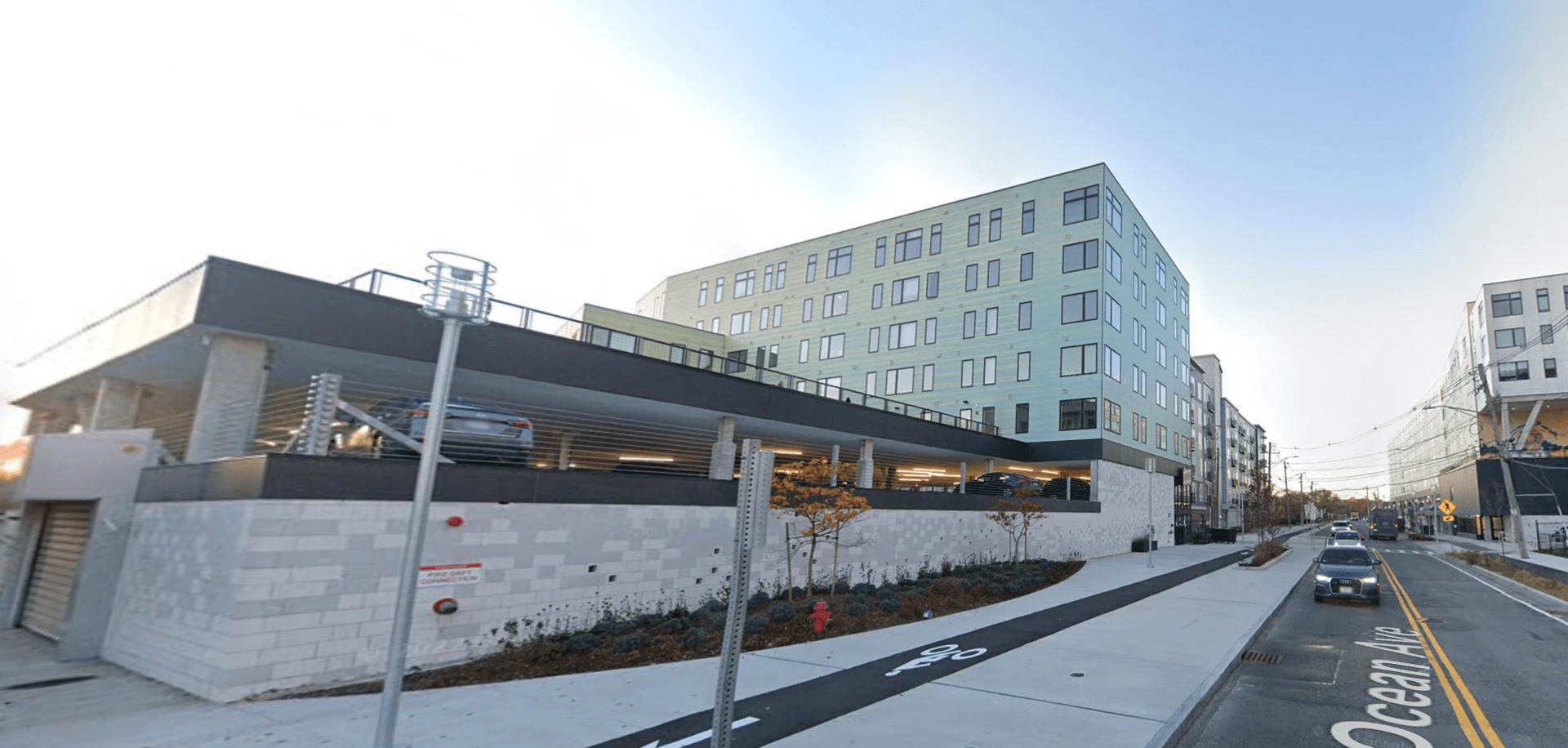 A building with a parking lot in front of it.