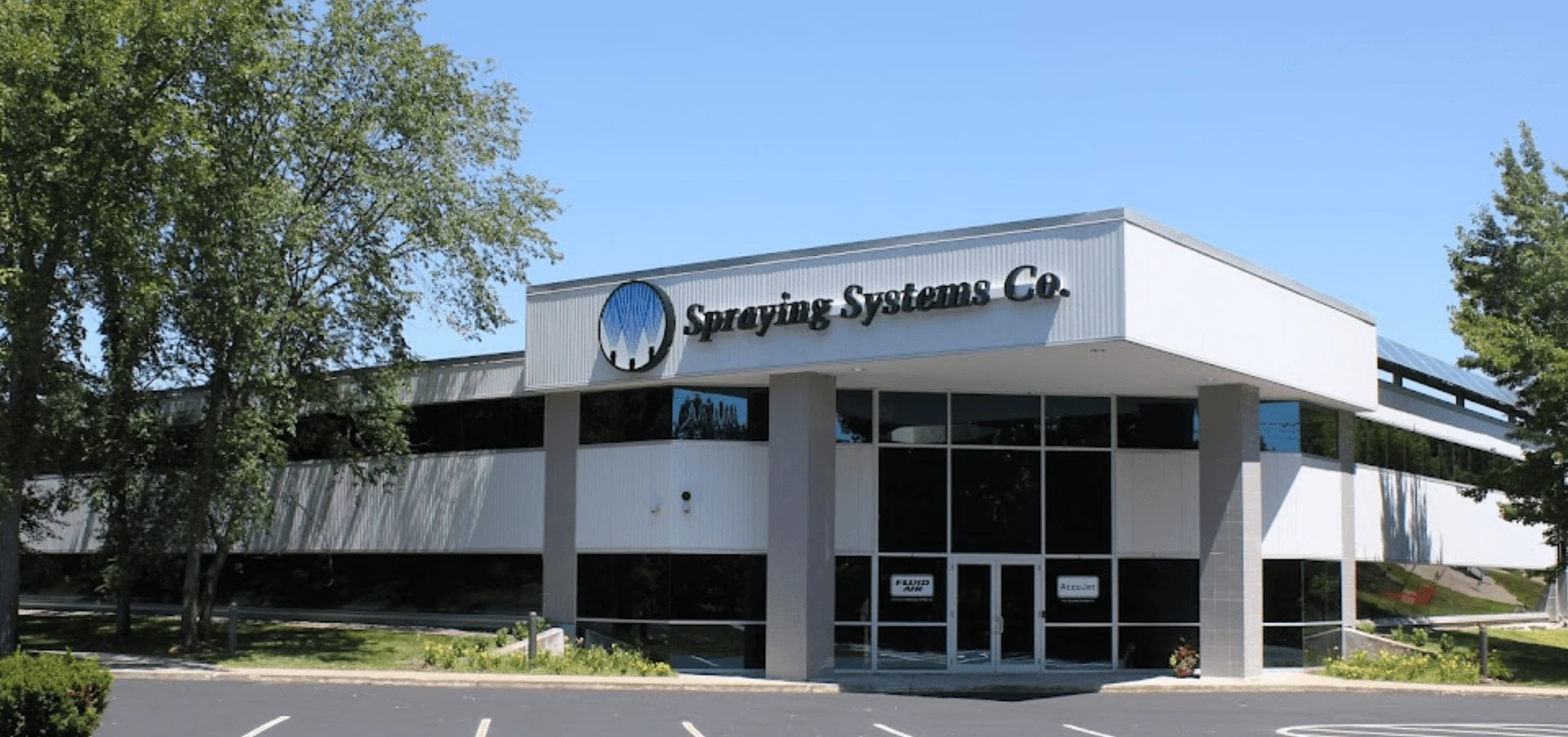 A building with a sign that says spring systems co.