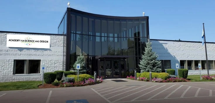 The front of a building with a sign on it.
