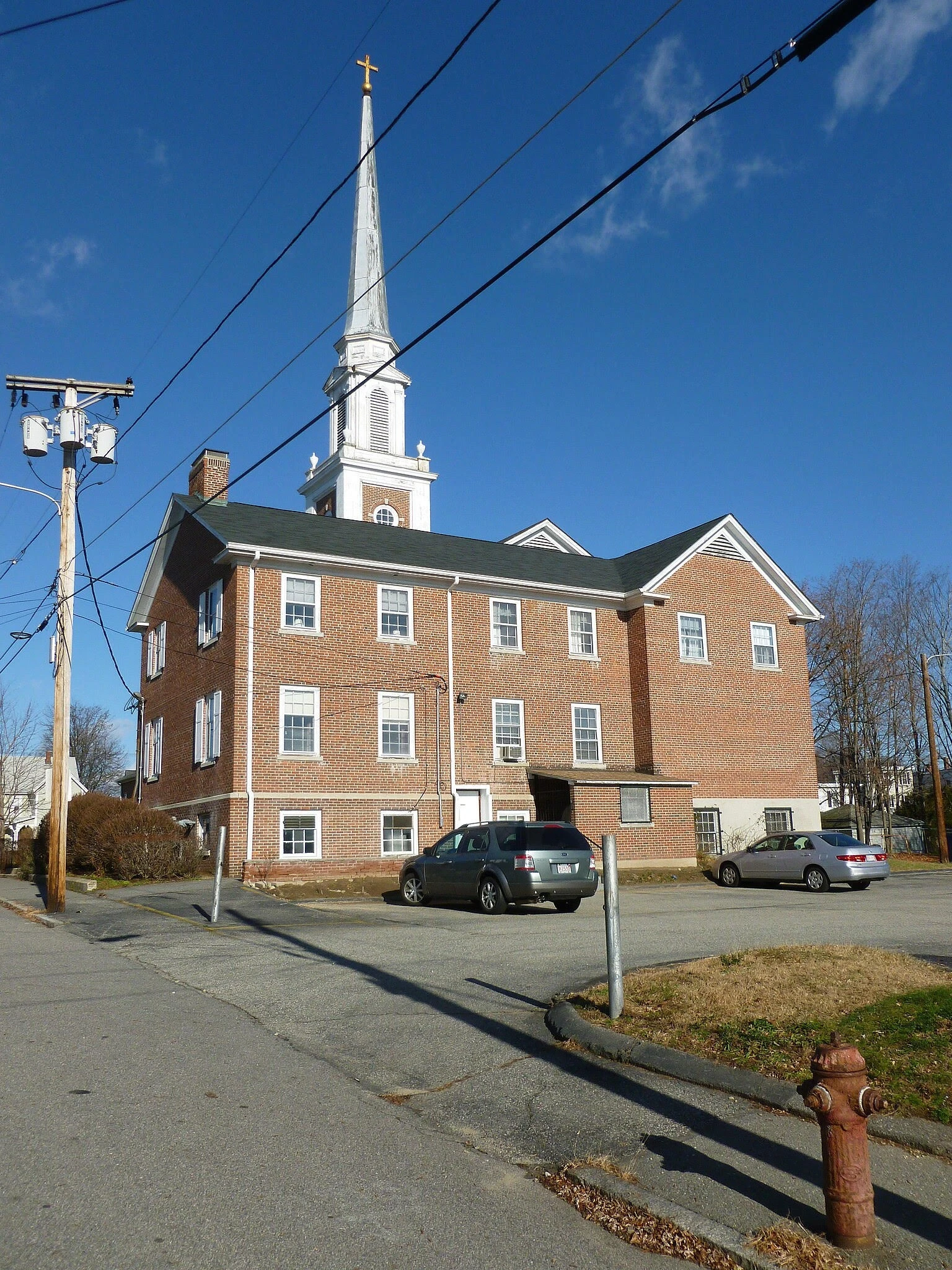 A brick building with a steeple.