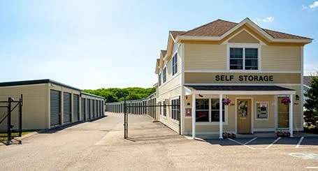A self storage facility in a parking lot.