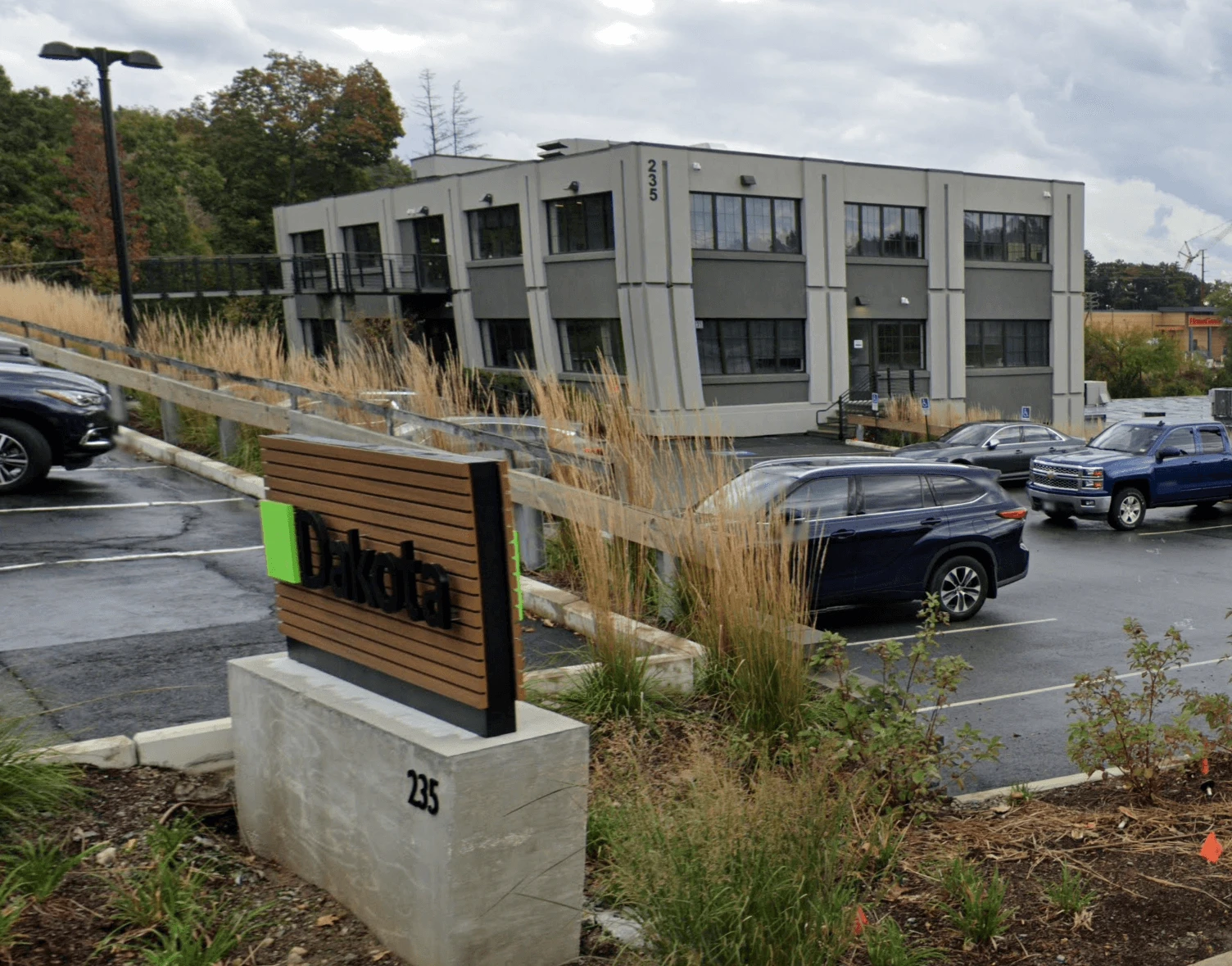 A lot of cars parked in a parking lot.