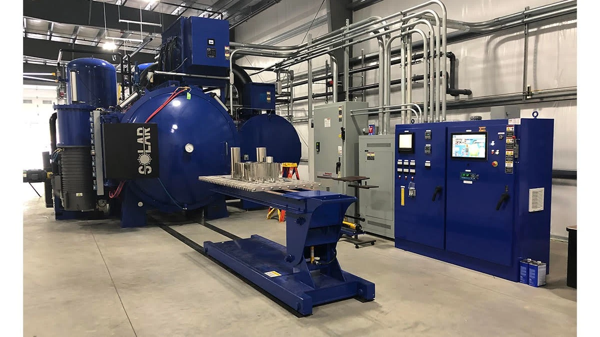 A blue machine in a large room.