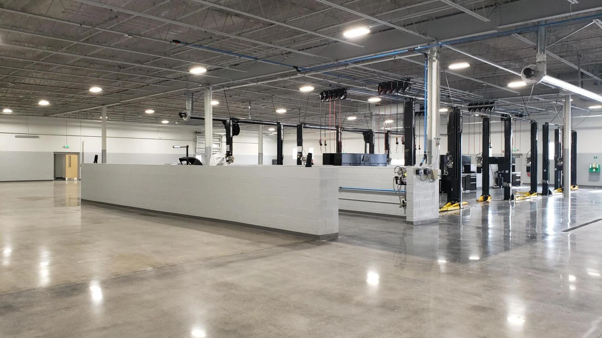 A large warehouse with a lot of equipment in it.