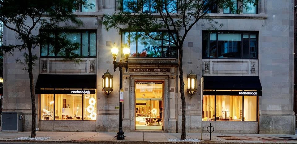 The exterior of a building with a storefront.