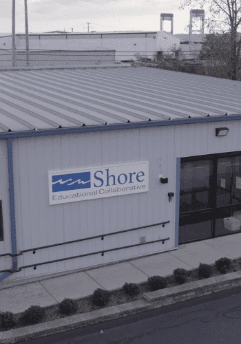 A building with a sign that says shore environmental.
