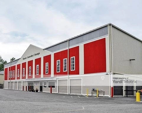 A red and white building in a parking lot.
